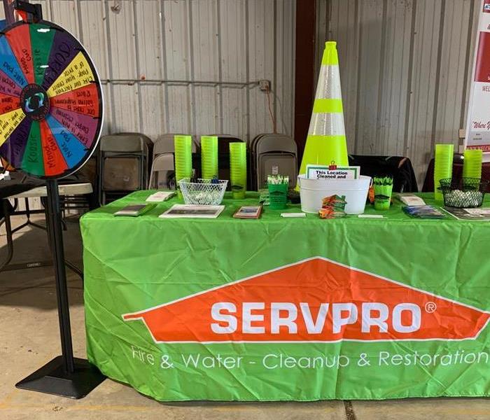 Eric and Kayly worked the Mayes County Livestock Show this fall and got to see lots of animals. The table is set up with SWAG